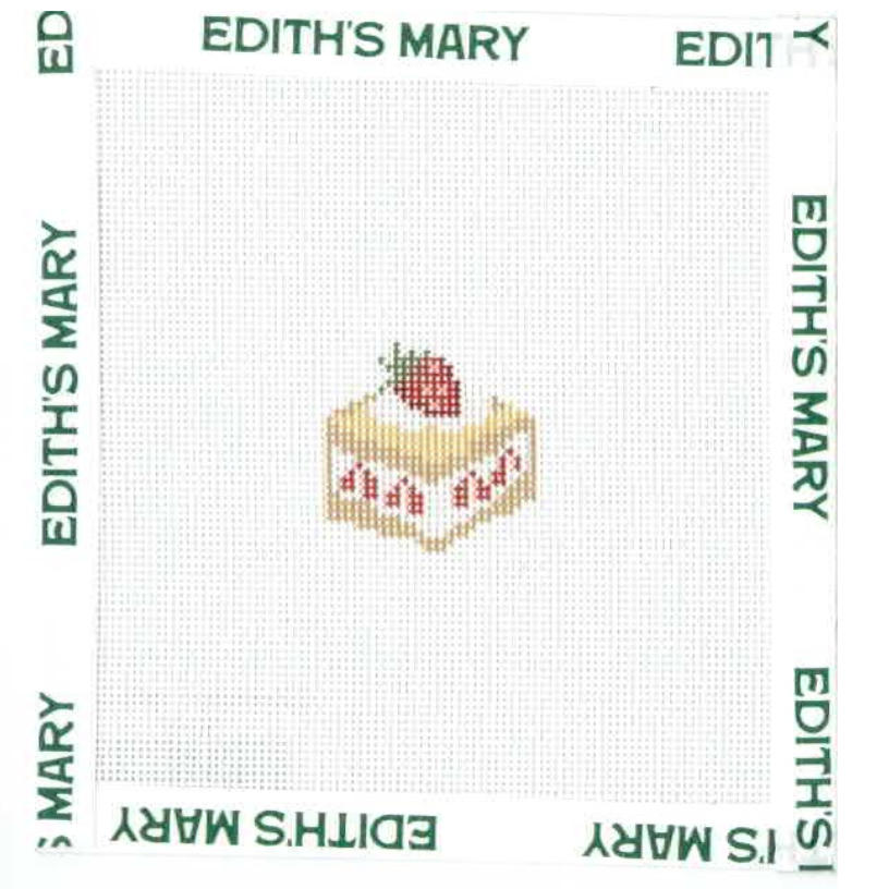 Needle Point design of a cake with strawberries on a fabric with 'Edith's Mary' branding.